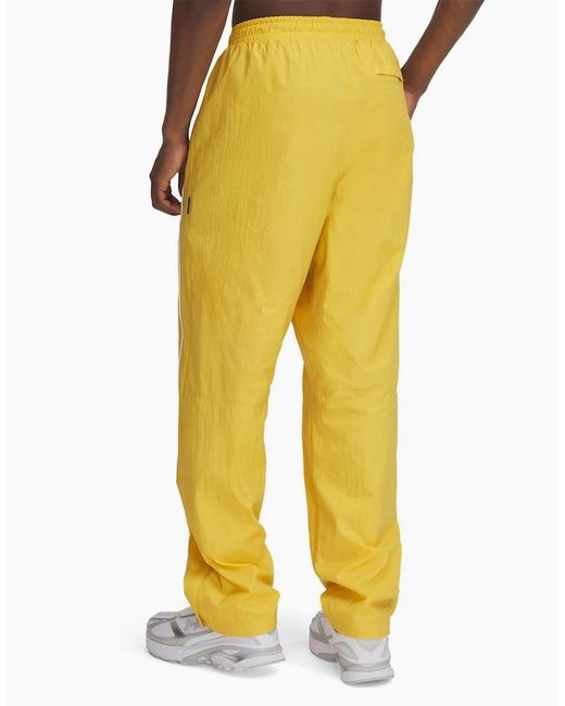 Under Armour Yellow Solid Patterned Track Pants for men