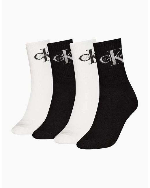Calvin Klein Black 4-Pack Ck Jeans Logo Sports Socks Gift Tin