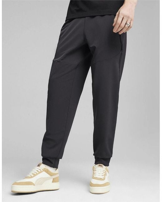 PUMA Black Zipped Pocket Solid Patterned Joggers for men