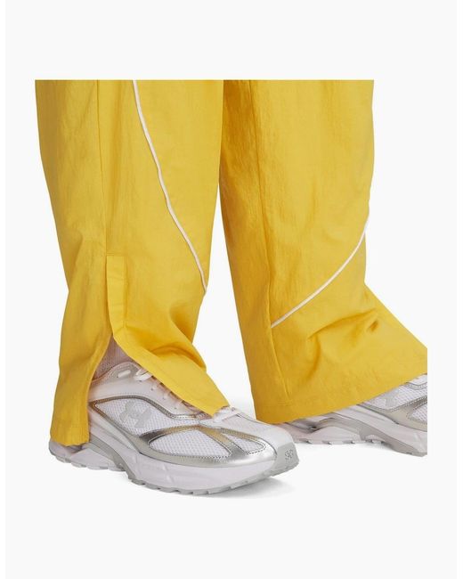 Under Armour Yellow Solid Patterned Track Pants for men