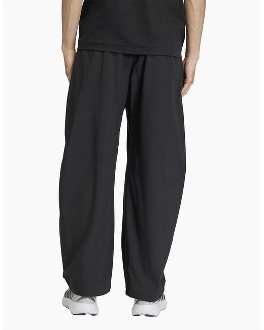 Adidas Black Z.N.E. Solid Patterned Wide Track Pants for men