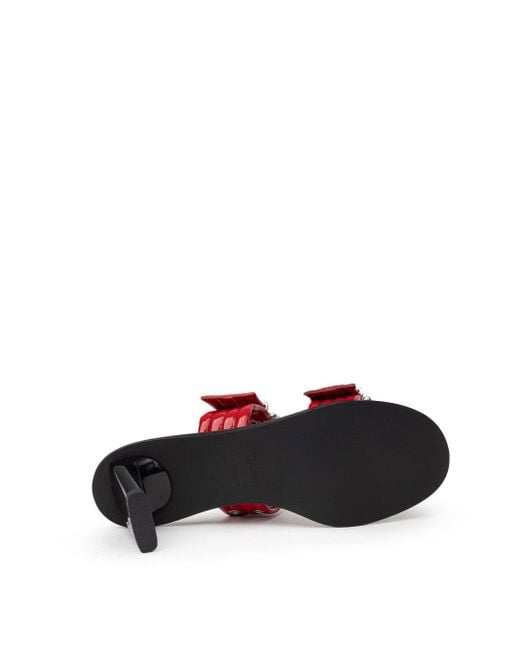 Sandali Mules Due Fasce Con Borchie Forate di Ganni in Red