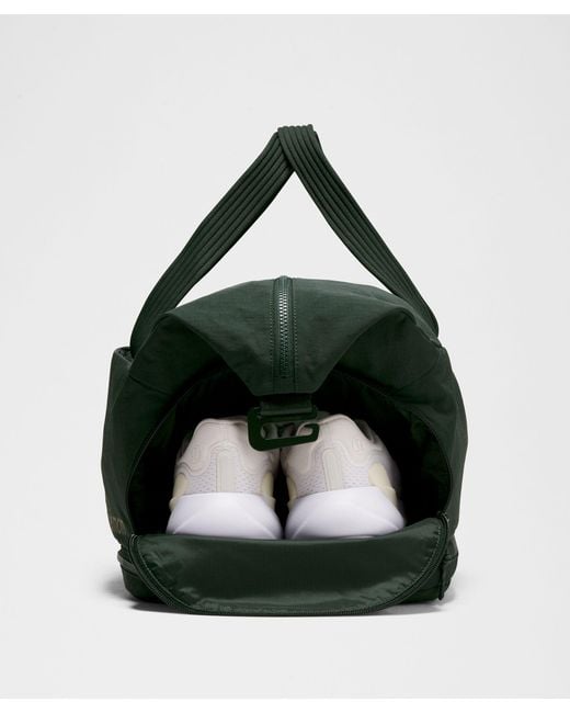green lululemon duffle bag 3-in-1 Gym 30L Side pockets for quick access to water bottle and small items lululemon 3-in-1 Gym Duffle Bag
