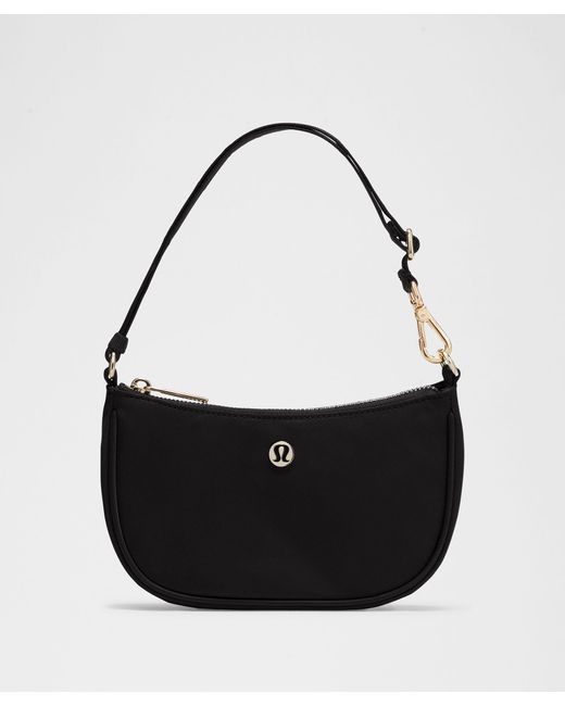 lululemon black and gold bag All Night Festival Crossbody Micro Belt 2L This lululemon Crossbody Camera Bag offers a sleek and contemporary way to carry your essentials while repping the Vegas Golden Knights This cross Lululemon Everywhere Crossbody Bag 2l