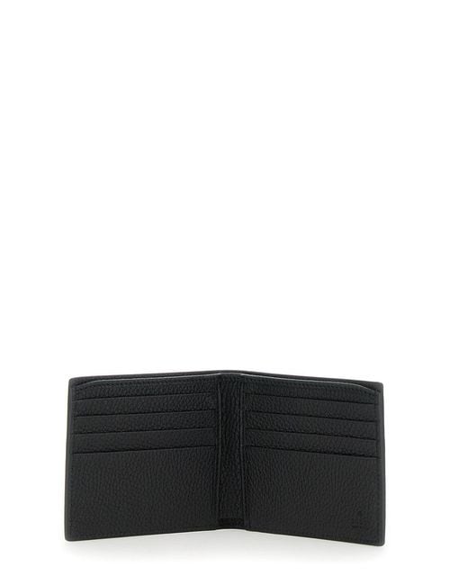 Gucci Black Bi-Fold Wallet With Embossed Logo Lettering On The Front for men