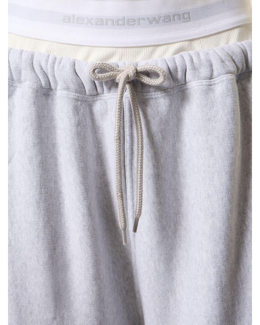 Pantalones deportivos anchos de algodón con logo Alexander Wang de color Blue