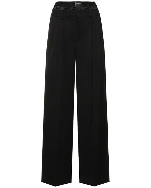 Pantaloni sartoriali vita bassa in lana di Alexander Wang in Black