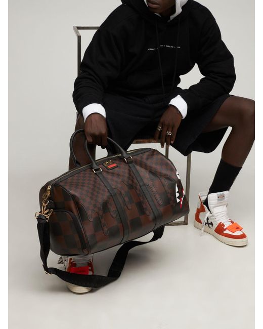 sprayground paris duffle
