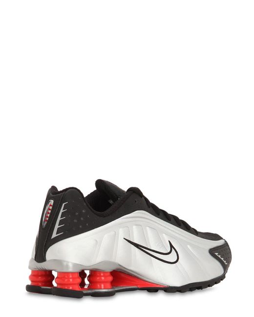 nike black shox r4 sneakers