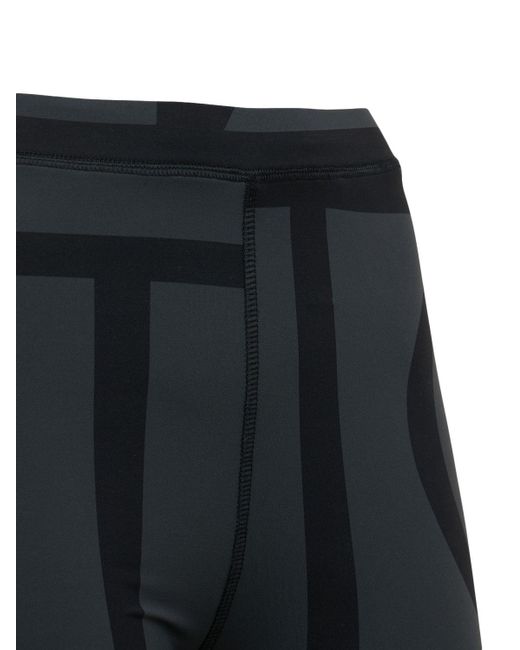 Leggings in techno riciclato monogram di Totême  in Black