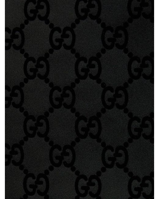 Jupe en duchesse de soie mélangée imprimé gg Gucci en coloris Black