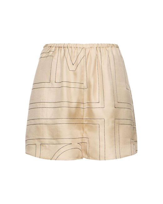 Shorts in seta monogram di Totême  in Natural