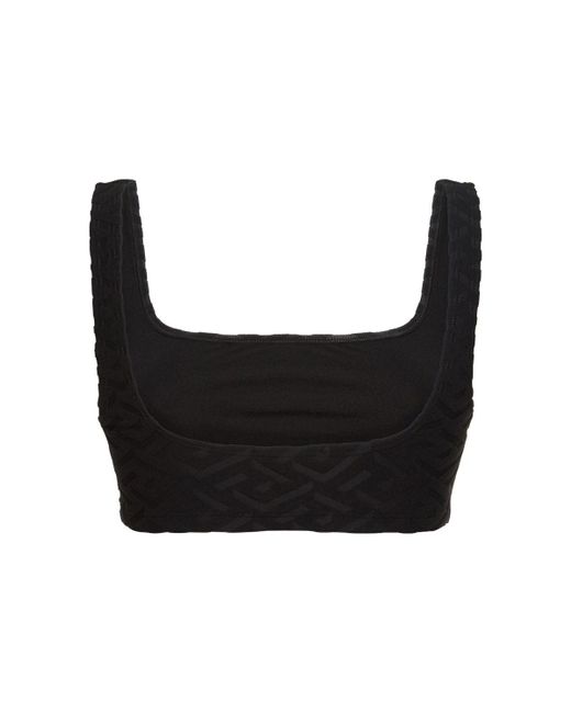 Top bikini in spugna monogram di Versace in Black