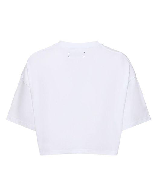 T-shirt cropped in jersey di cotone con logo di Amiri in White
