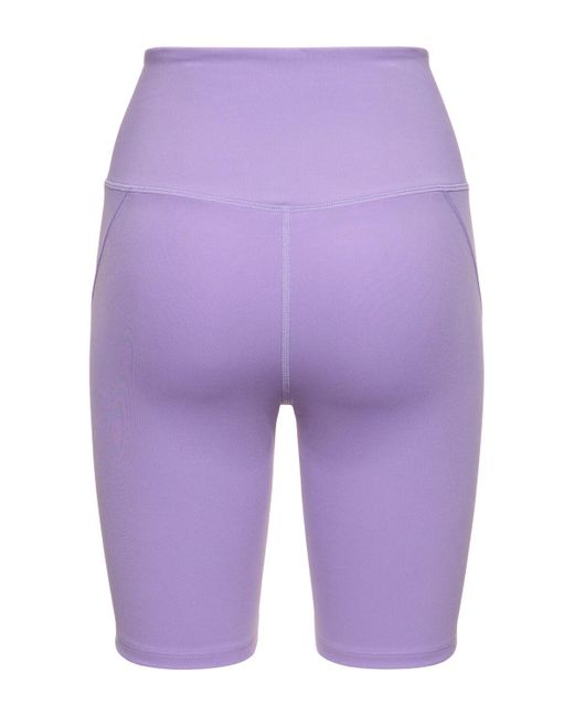 Shorts running cintura alta de tech stretch GIRLFRIEND COLLECTIVE de color Purple