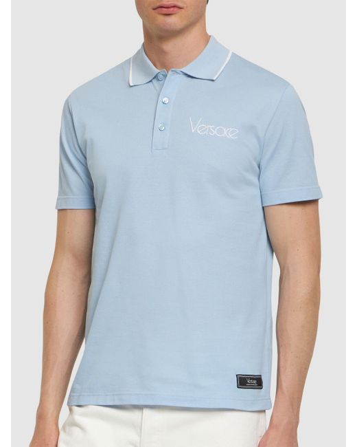 Polo en piqué de coton à logo Versace pour homme en coloris Blue