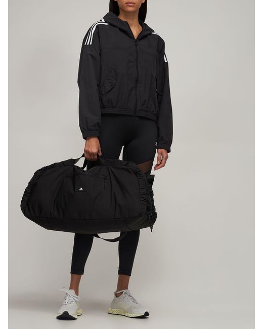 hjort Derved Opdage adidas Originals Yoga Studio Earth Duffle Bag in Black | Lyst