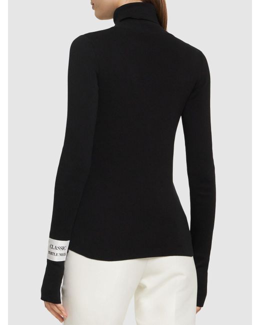 Suéter de punto de algodón cuello alto Moschino de color Black