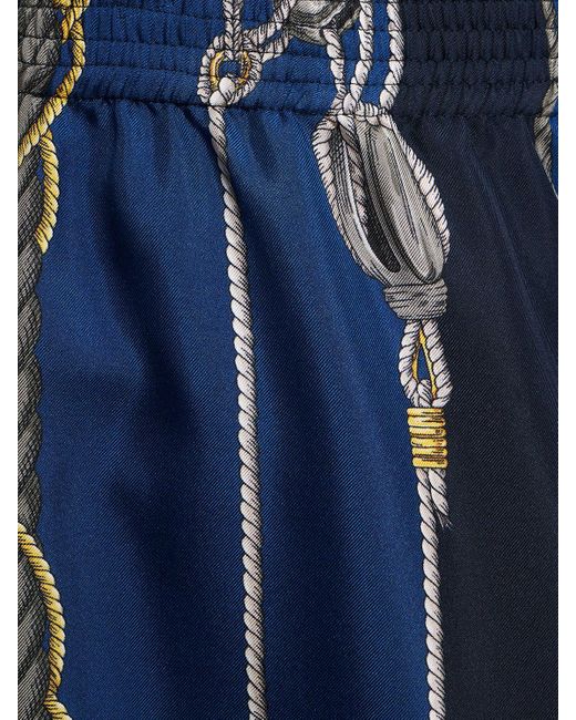 Shorts in seta stampata di Versace in Blue da Uomo