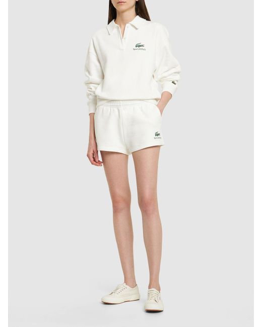Sporty & Rich White Lacoste Serif Disco Shorts