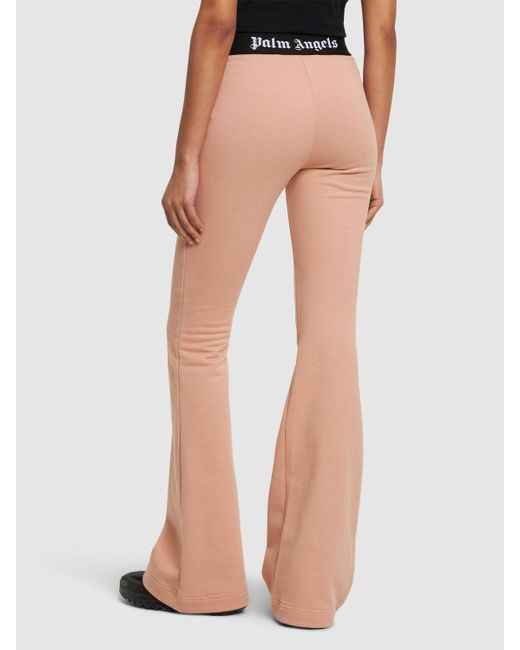 Pantalon évasé en coton avec bande logo Palm Angels en coloris Pink