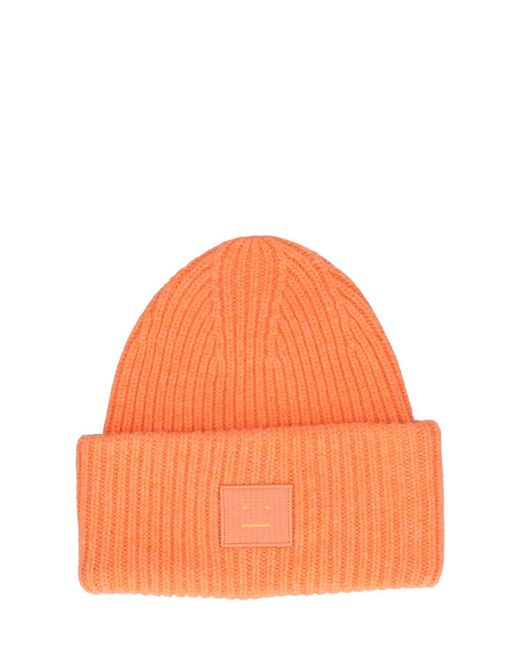 Cappello beanie pansie face in lana di Acne in Orange da Uomo