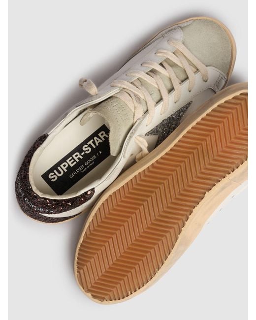 Baskets en cuir et daim super star 20 mm Golden Goose Deluxe Brand en coloris White