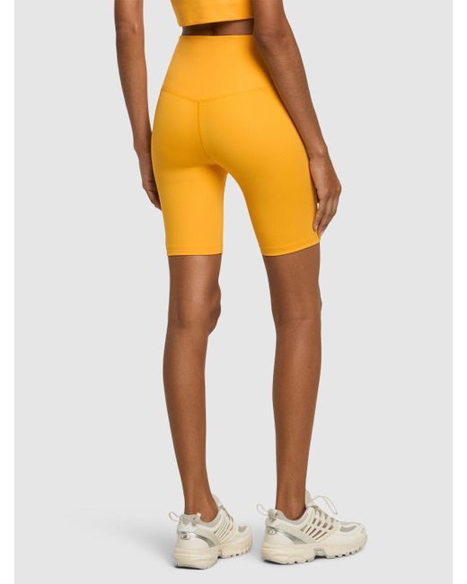 Shorts running cintura alta de tech stretch GIRLFRIEND COLLECTIVE de color Yellow