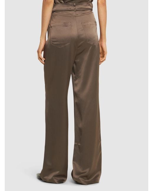 Pantalon à cordons en satin sato Nanushka en coloris Brown