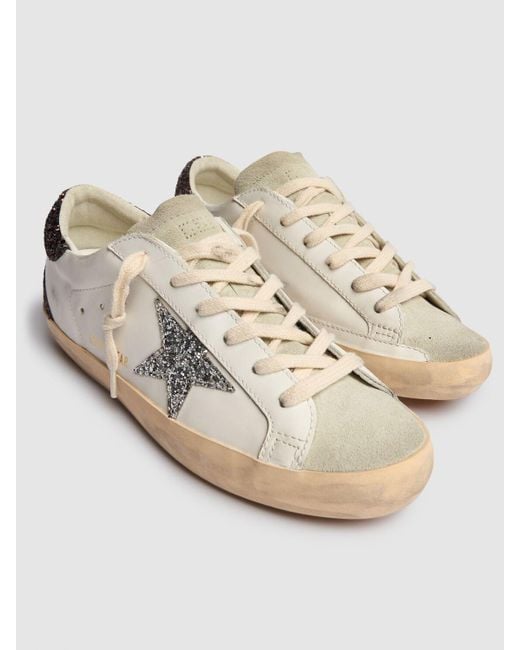 Baskets en cuir et daim super star 20 mm Golden Goose Deluxe Brand en coloris White