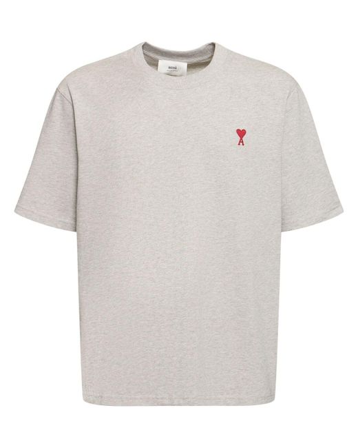 T-shirt in cotone con logo di AMI in White da Uomo