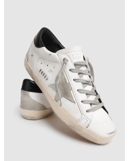 Sneakers super-star in pelle e camoscio 20mm di Golden Goose Deluxe Brand in White
