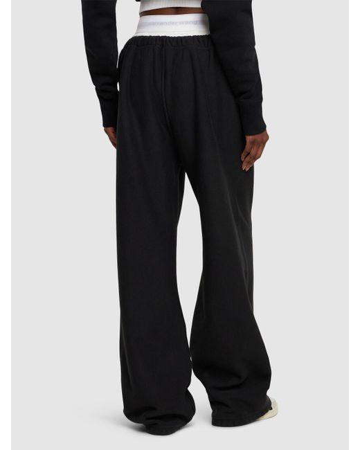 Pantalones deportivos anchos de algodón con logo Alexander Wang de color Black