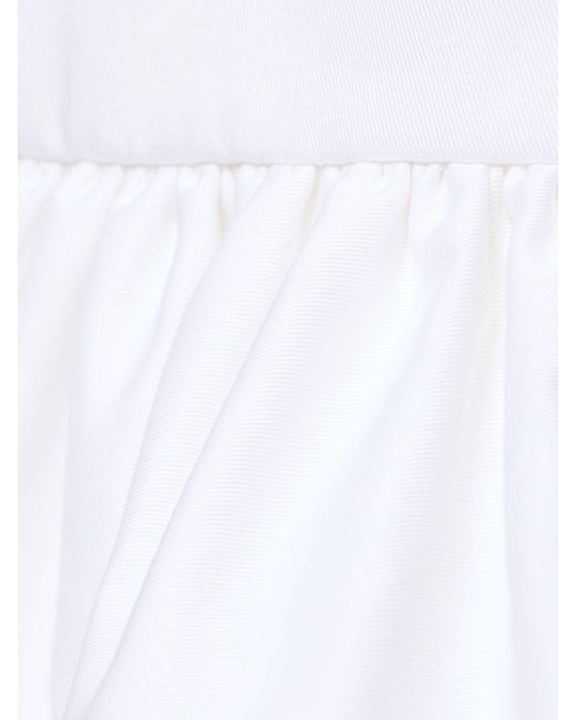 Jupe courte en gabardine de coton froncé Patou en coloris White