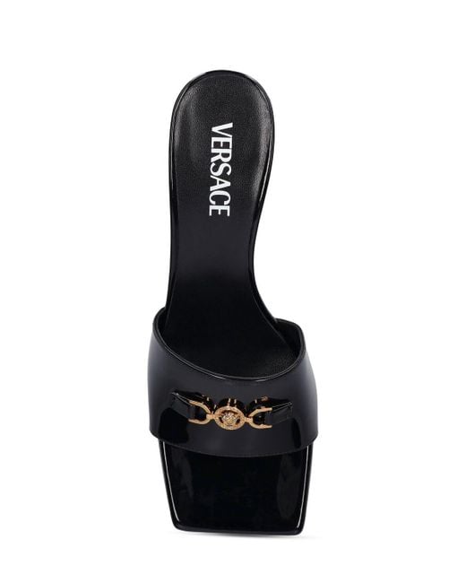 Mules in vernice 55mm di Versace in Black