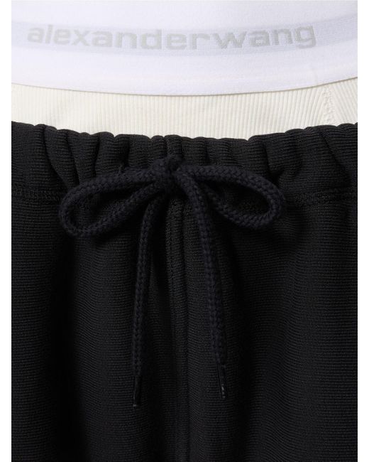 Pantaloni larghi in felpa di cotone / logo di Alexander Wang in Black