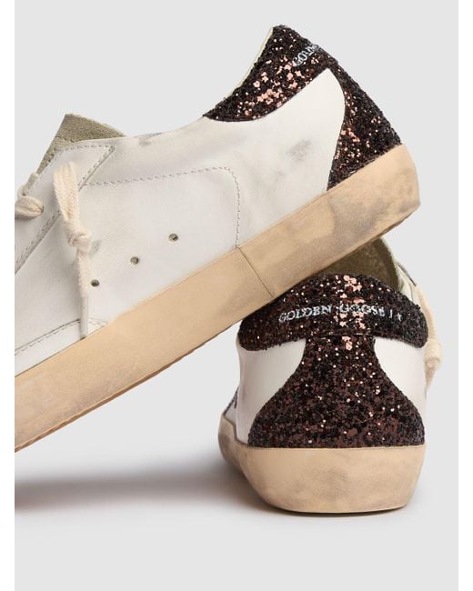 Baskets en cuir et daim super star 20 mm Golden Goose Deluxe Brand en coloris White