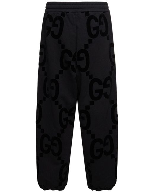 Pantalon de survêtet en coton floqué gg Gucci pour homme en coloris Black