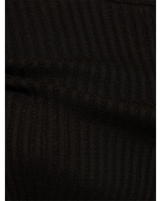 Crop top asimmetrico in maglia di Amiri in Black