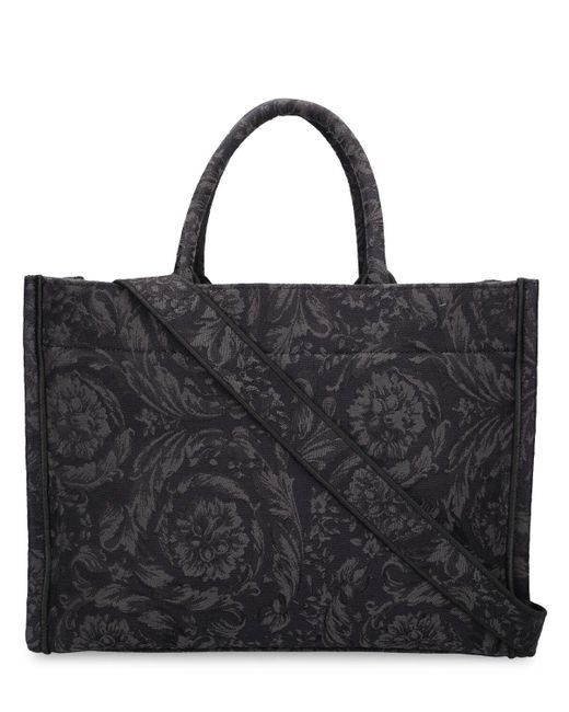 Bolso tote grande con logo jacquard Versace de color Black