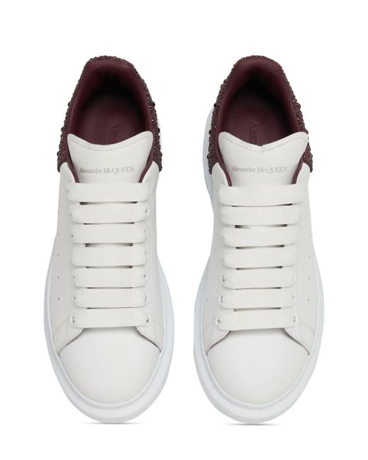 Sneakers in pelle con decorazioni 45mm di Alexander McQueen in White