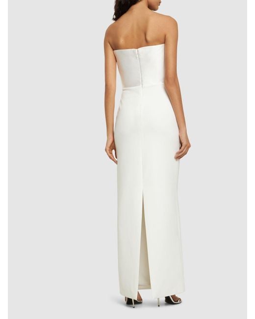 Afra crepe knit strapless maxi dress di Solace London in White