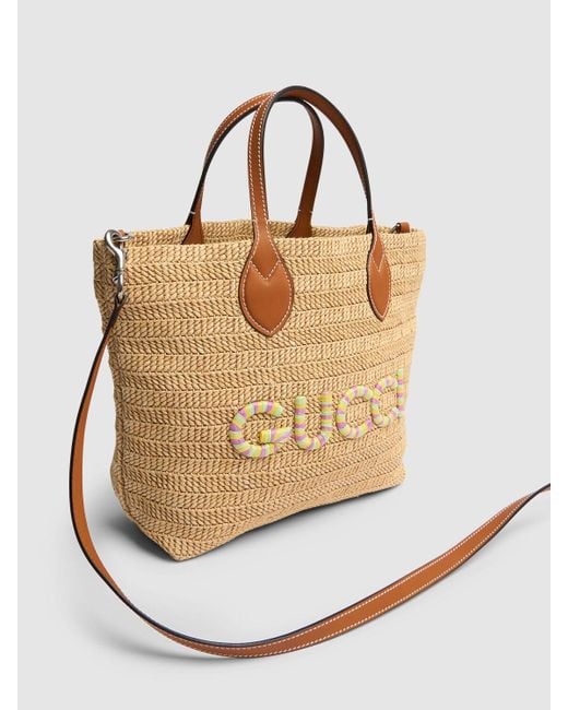 Borsa shopping piccola in rafia con logo di Gucci in Natural