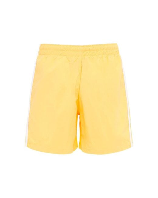 pastel yellow adidas shorts