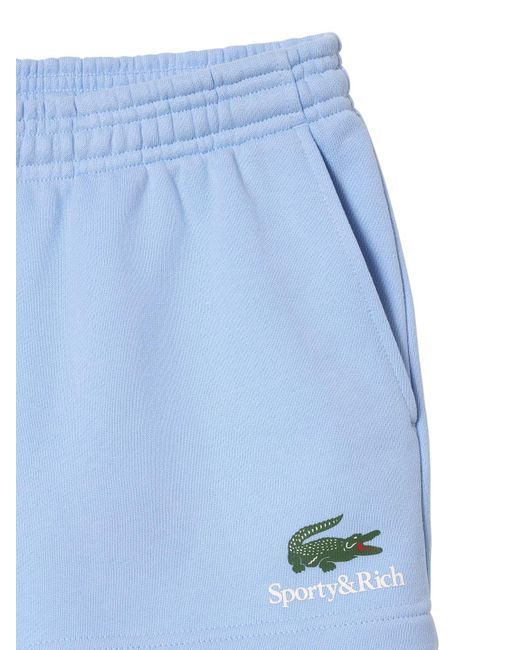 Sporty & Rich Blue Disco-shorts "lacoste Serif"