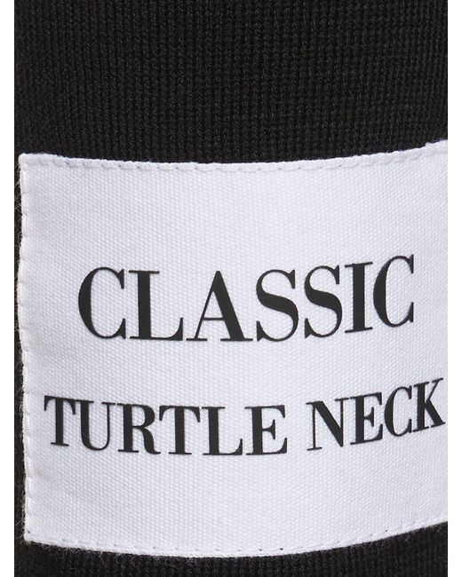 Suéter de punto de algodón cuello alto Moschino de color Black