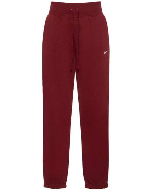 Pantaloni vita alta in felpa di Nike in Red