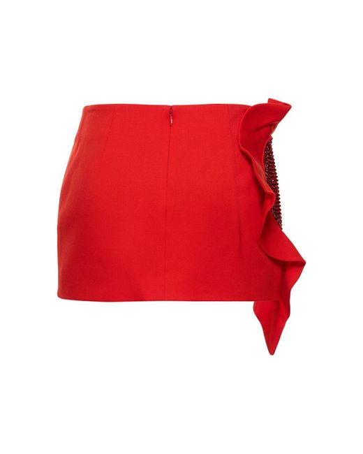 Jupe courte en laine stretch à volants Area en coloris Red