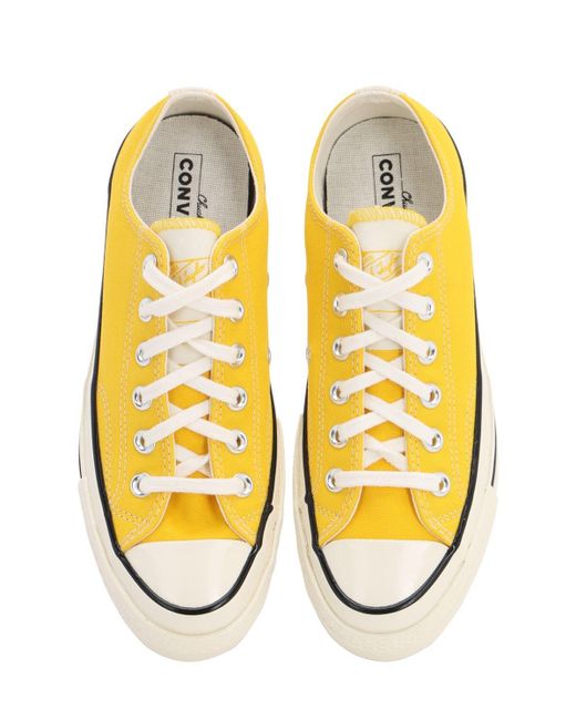 converse yellow trainers