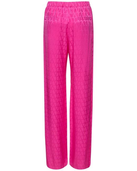 Pantaloni dritti in seta jacquard con logo di Valentino in Pink
